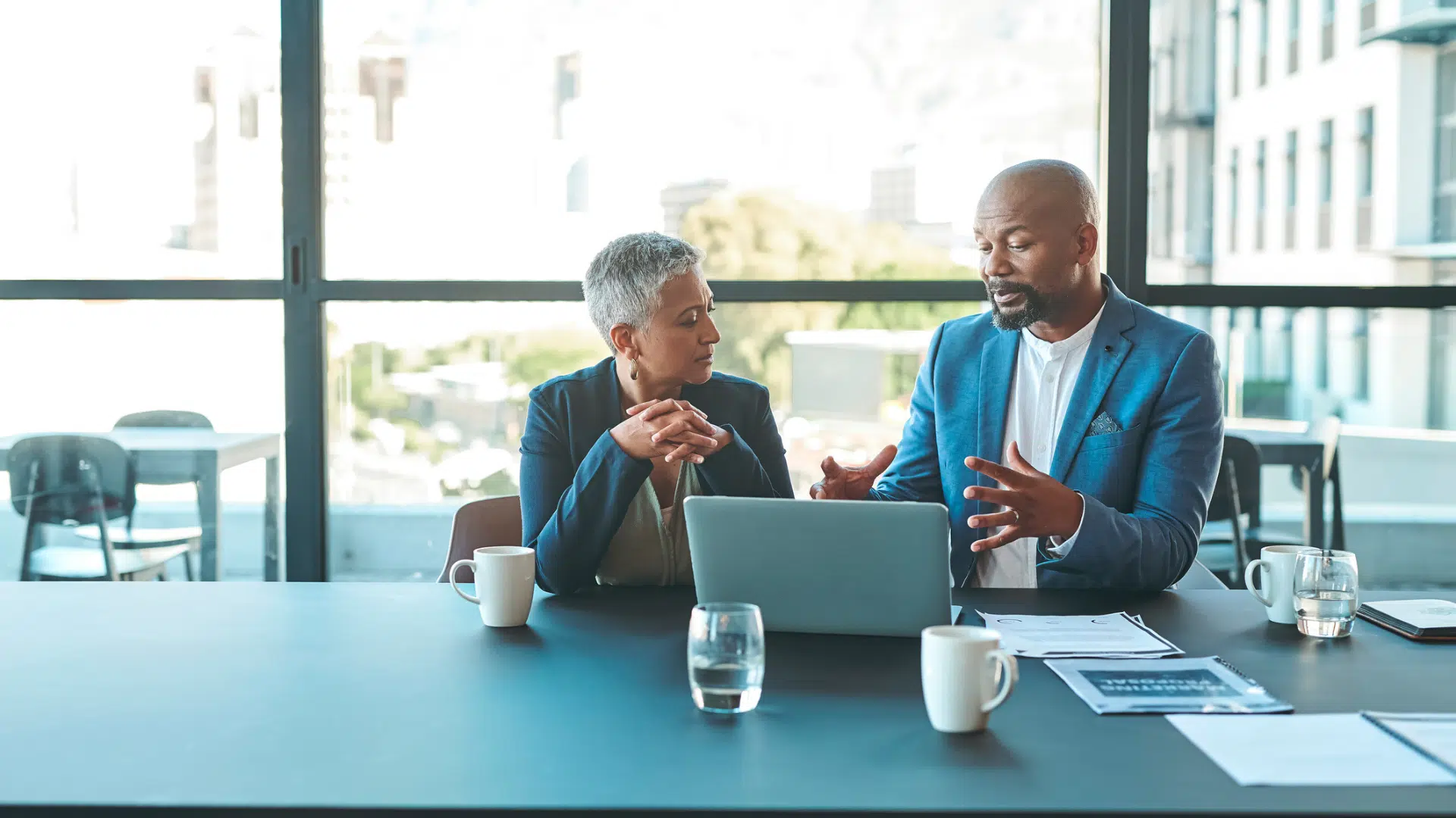 A mentor and mentee exchange ideas during a mentoring program.