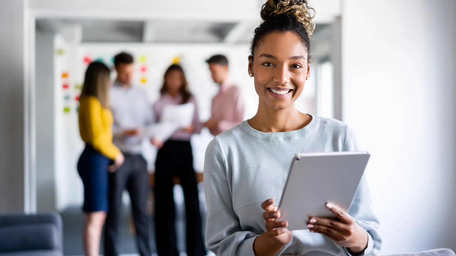 A business leader enjoying a successful digital transformation at her organization.